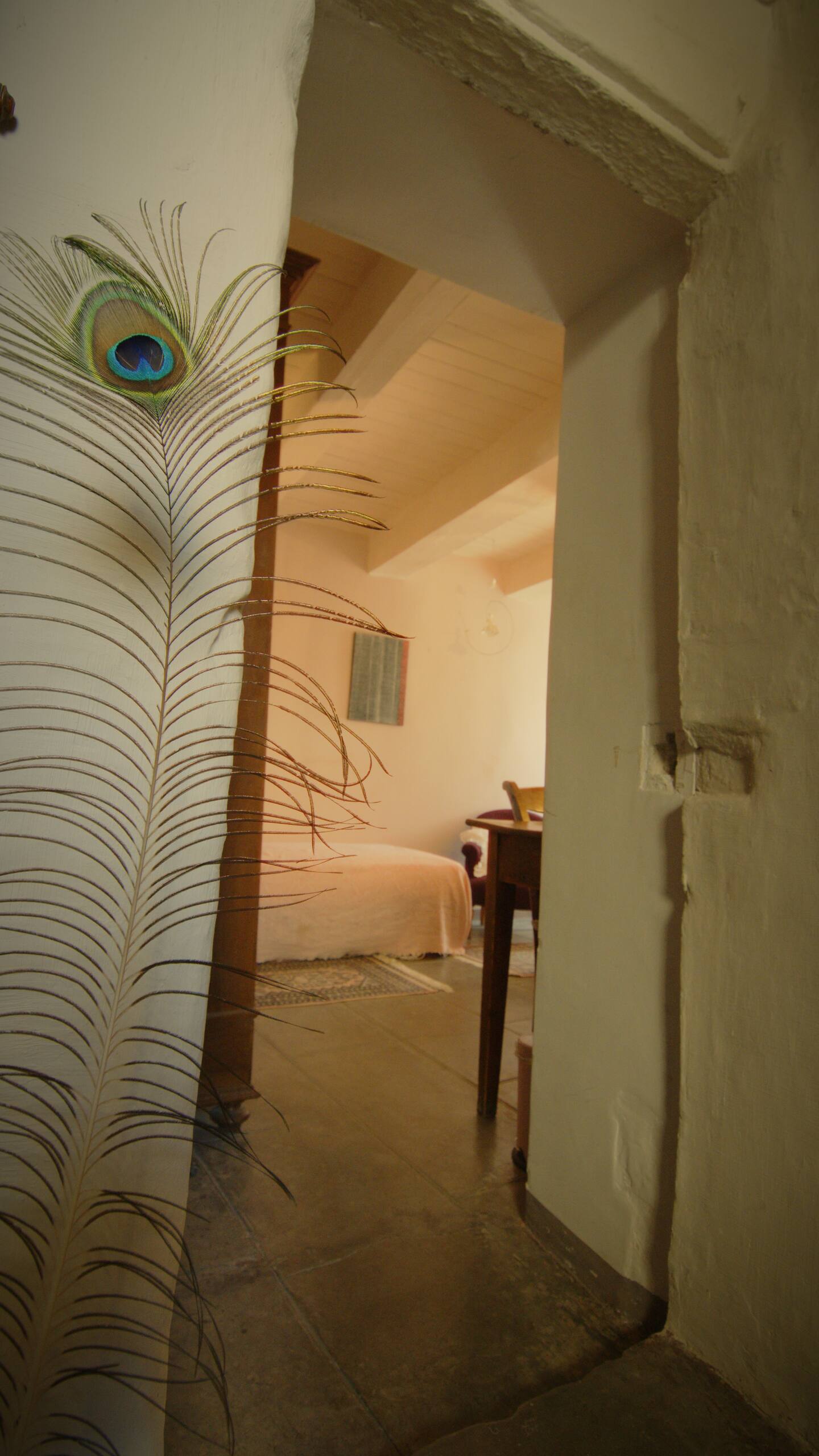 Peacock wall decor in the Blue Room